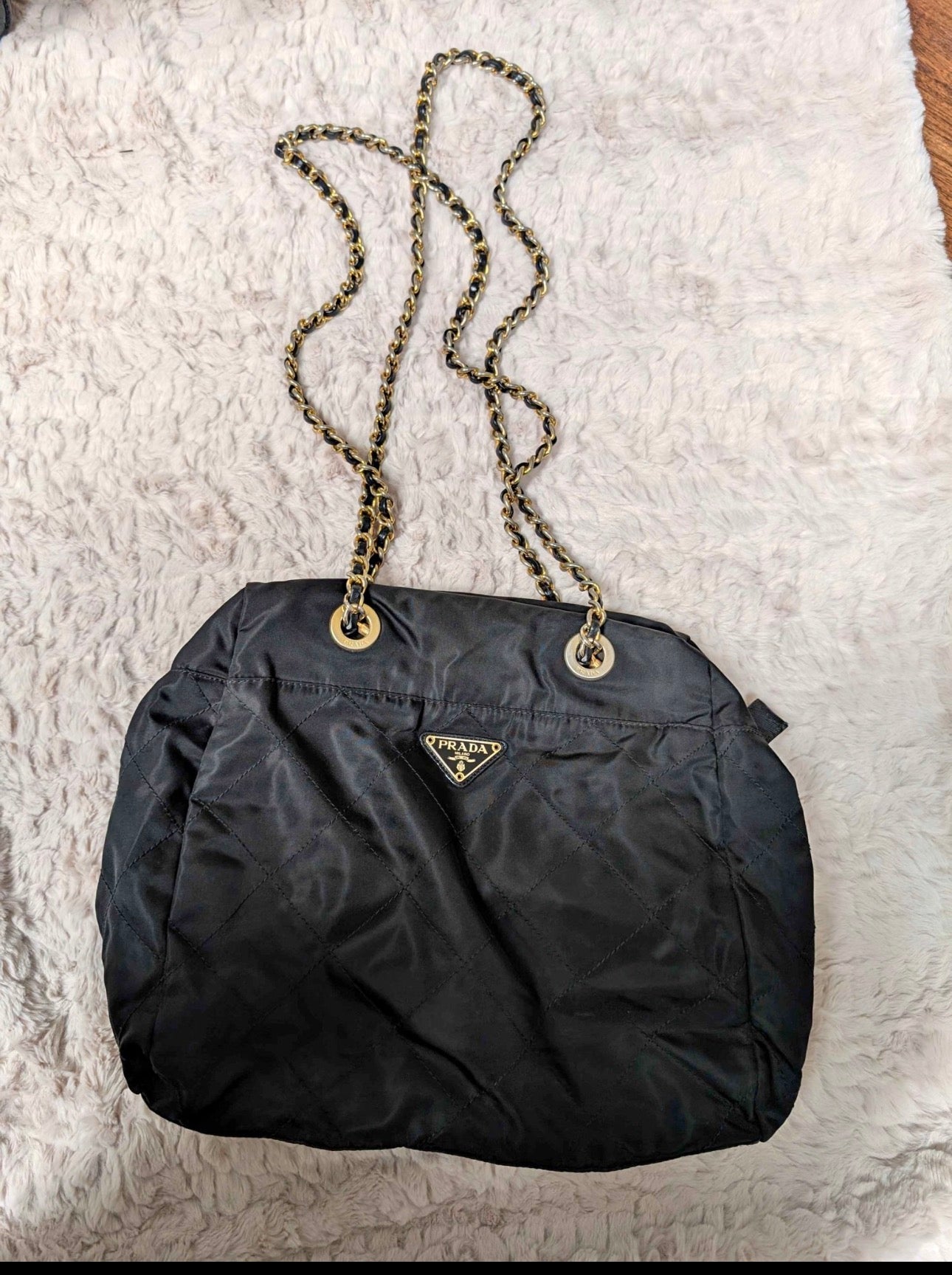 vintage Prada quilted nylon tote in black with gold tone chain and leather shoulder straps
